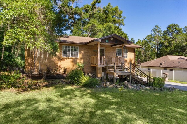 5581 SW 197th Ter, Dunnellon, FL 34431 - view of front facade with stairs and brick siding