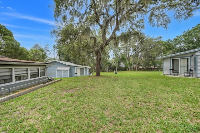 10301 US Highway 27 Unit 187, Clermont, FL 34711 - view of green lawn featuring a garage