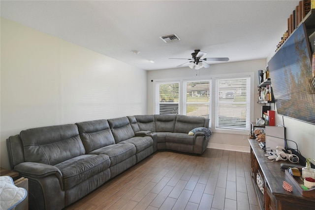 1226 Overlook Rd, Eustis, FL 32726 - living room featuring ceiling fan, baseboards, and dark wood-style flooring