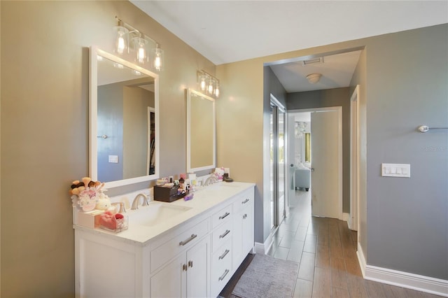 1226 Overlook Rd, Eustis, FL 32726 - full bath with double vanity, wood finished floors, and baseboards