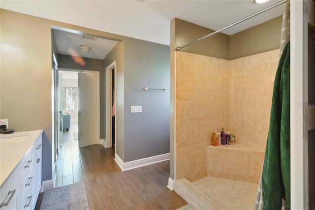 1226 Overlook Rd, Eustis, FL 32726 - full bathroom featuring tiled shower, vanity, and wood finished floors