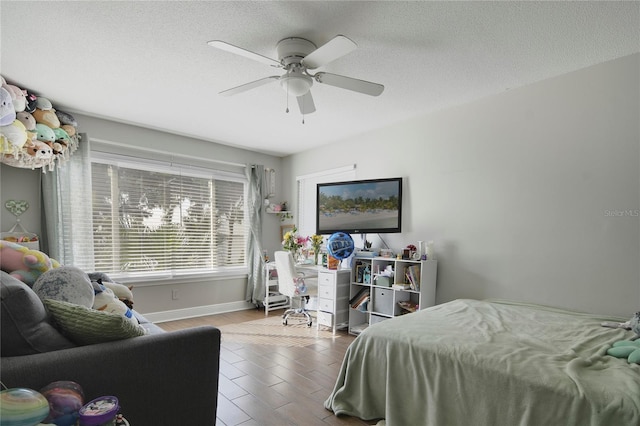 1226 Overlook Rd, Eustis, FL 32726 - bedroom with wood finished floors, a textured ceiling, a ceiling fan, and baseboards