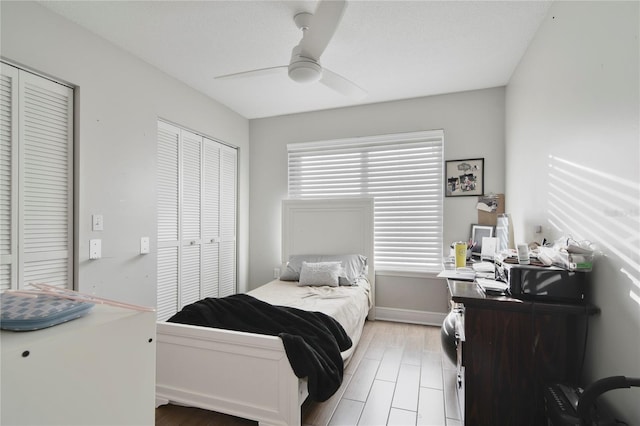 1226 Overlook Rd, Eustis, FL 32726 - bedroom with a desk, a ceiling fan, baseboards, and light wood-type flooring
