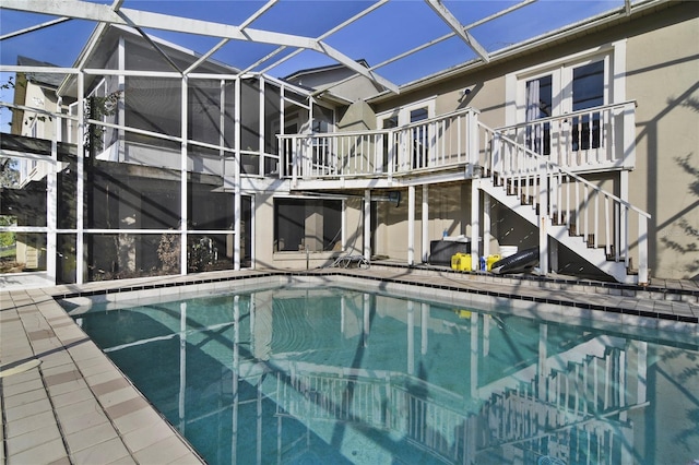 1226 Overlook Rd, Eustis, FL 32726 - outdoor pool featuring stairway, glass enclosure, and a patio area