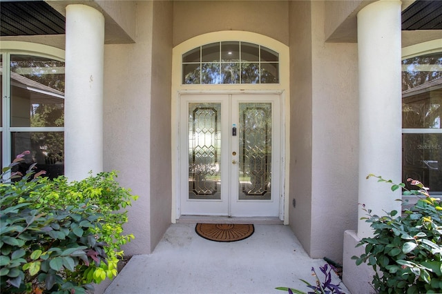 11036 Bronson Rd, Clermont, FL 34711 - property entrance featuring french doors and stucco siding