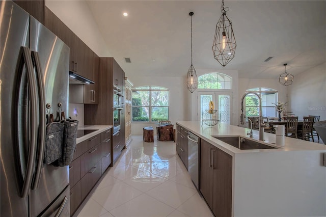 11036 Bronson Rd, Clermont, FL 34711 - kitchen with stainless steel appliances, healthy amount of natural light, under cabinet range hood, modern cabinets, and recessed lighting