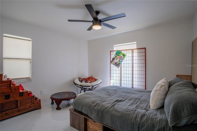 11036 Bronson Rd, Clermont, FL 34711 - tiled bedroom with a ceiling fan