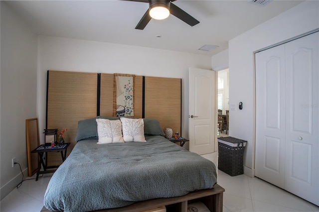 11036 Bronson Rd, Clermont, FL 34711 - bedroom with light tile patterned flooring, a closet, and a ceiling fan