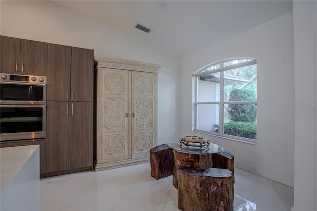 11036 Bronson Rd, Clermont, FL 34711 - living area featuring lofted ceiling and light tile patterned floors