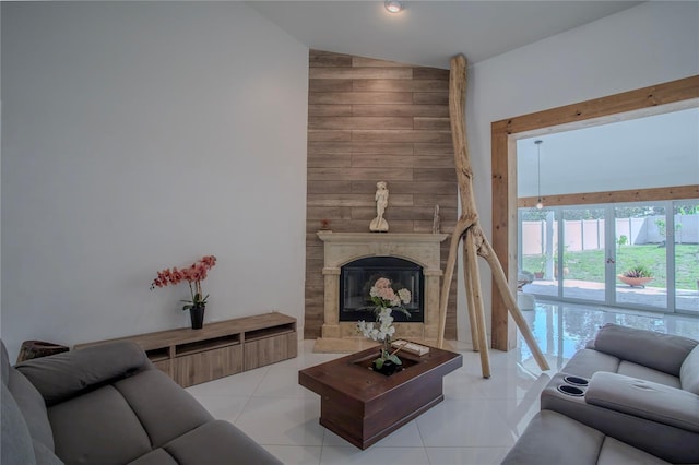 11036 Bronson Rd, Clermont, FL 34711 - living area with high vaulted ceiling, a high end fireplace, and light tile patterned floors