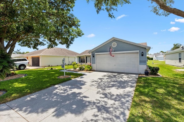 612 Lisbon Ln, The Villages, FL 32159 - ranch-style house featuring concrete driveway, an attached garage, and a front yard