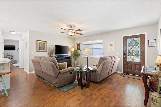612 Lisbon Ln, The Villages, FL 32159 - living area with wood finished floors, a ceiling fan, and baseboards