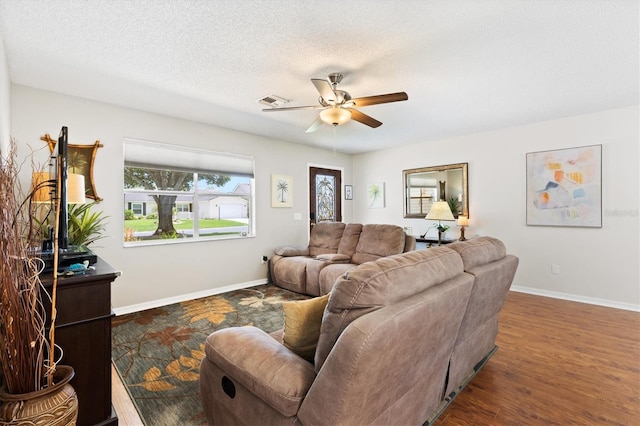 612 Lisbon Ln, The Villages, FL 32159 - living area with ceiling fan, baseboards, wood finished floors, and a textured ceiling