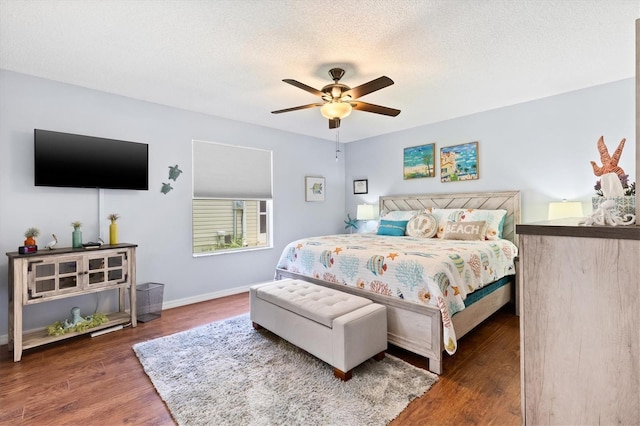 612 Lisbon Ln, The Villages, FL 32159 - bedroom with wood finished floors, ceiling fan, baseboards, and a textured ceiling