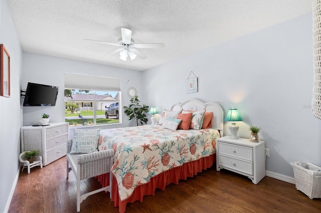 612 Lisbon Ln, The Villages, FL 32159 - bedroom featuring wood finished floors, baseboards, a textured ceiling, and a ceiling fan