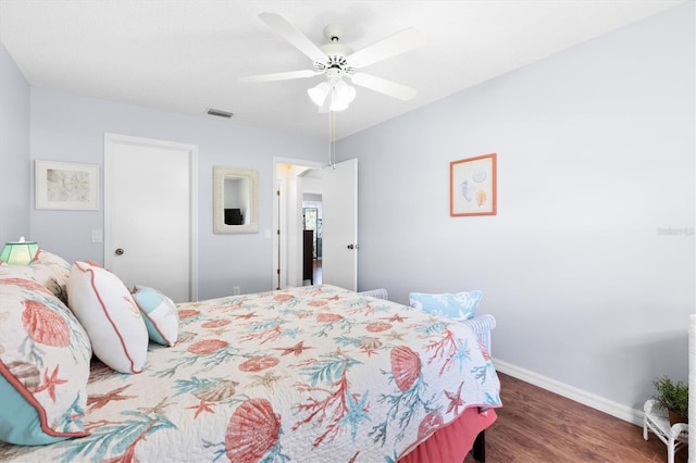 612 Lisbon Ln, The Villages, FL 32159 - bedroom with wood finished floors, baseboards, and ceiling fan