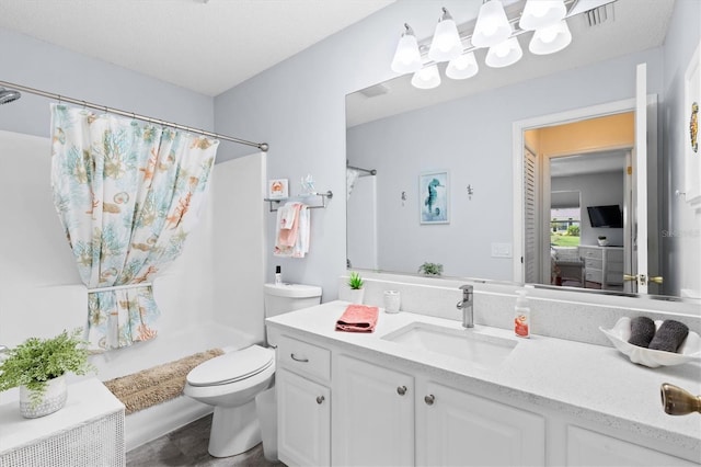 612 Lisbon Ln, The Villages, FL 32159 - full bathroom with vanity, curtained shower, and toilet