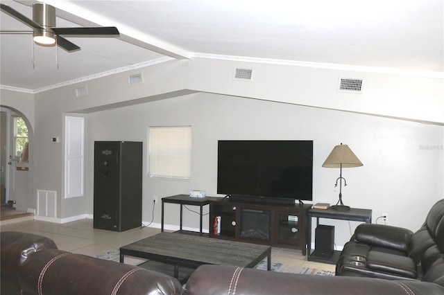 705 Poinsettia Ave, Fruitland Park, FL 34731 - living room featuring arched walkways, baseboards, a ceiling fan, and tile patterned flooring