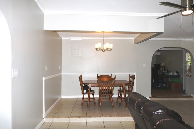705 Poinsettia Ave, Fruitland Park, FL 34731 - dining space with arched walkways, ceiling fan, light tile patterned floors, a chandelier, and baseboards