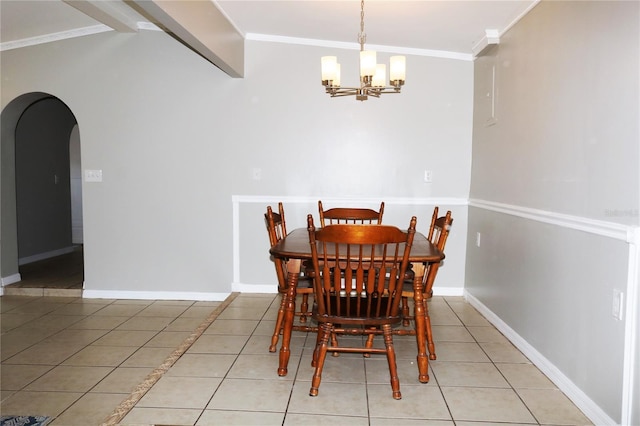 705 Poinsettia Ave, Fruitland Park, FL 34731 - dining room featuring arched walkways, a chandelier, crown molding, light tile patterned flooring, and baseboards