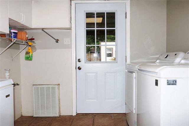 705 Poinsettia Ave, Fruitland Park, FL 34731 - washroom with washing machine and clothes dryer and cabinet space