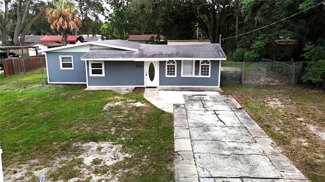 705 Poinsettia Ave, Fruitland Park, FL 34731 - view of front facade featuring covered porch, stucco siding, and driveway
