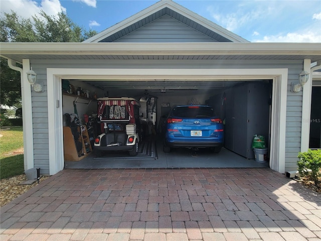 8980 SE 176th Limerick Ln, The Villages, FL 32162 - garage featuring decorative driveway