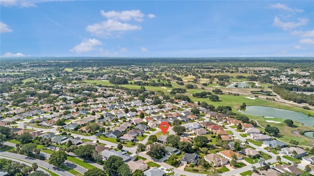 8980 SE 176th Limerick Ln, The Villages, FL 32162 - aerial overview of property's location with a local golf course, a nearby body of water, and nearby suburban area