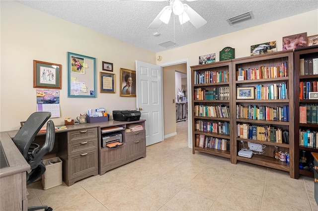 8980 SE 176th Limerick Ln, The Villages, FL 32162 - office space featuring a ceiling fan, a textured ceiling, and light tile patterned floors