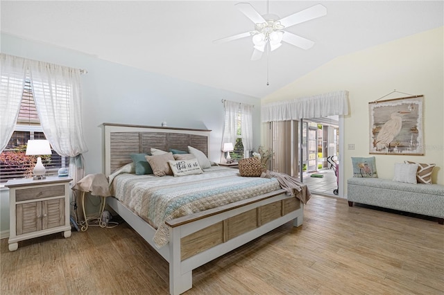 8980 SE 176th Limerick Ln, The Villages, FL 32162 - bedroom with wood finished floors, vaulted ceiling, access to exterior, and a ceiling fan