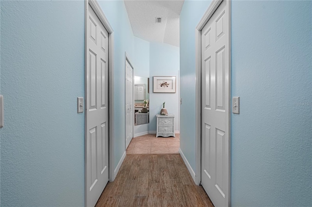 8980 SE 176th Limerick Ln, The Villages, FL 32162 - hall featuring wood finished floors and baseboards
