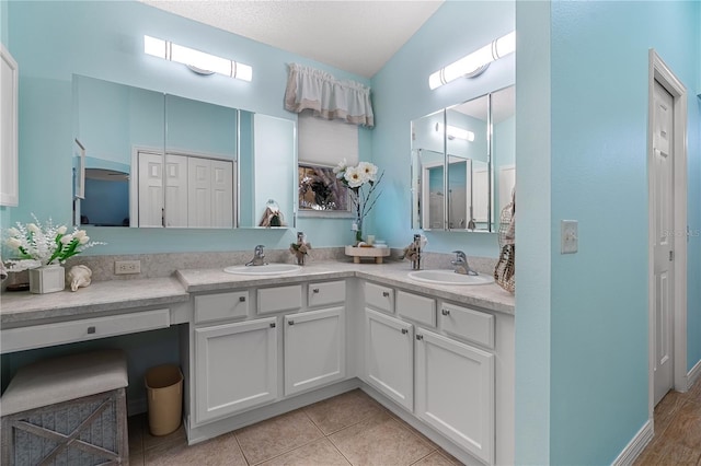 8980 SE 176th Limerick Ln, The Villages, FL 32162 - full bathroom with double vanity, tile patterned flooring, and a closet