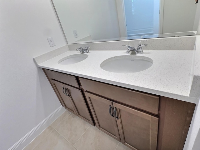 358 Switchgrass Loop, Minneola, FL 34715 - full bathroom with tile patterned floors, double vanity, and baseboards