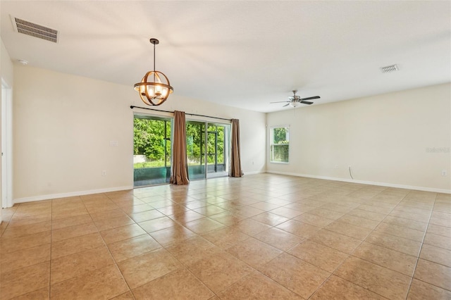 185 Hamlet Loop, Davenport, FL 33837 - empty room featuring light tile patterned floors, ceiling fan, and a chandelier
