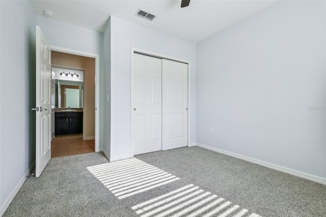 185 Hamlet Loop, Davenport, FL 33837 - unfurnished bedroom featuring carpet floors, a closet, and ceiling fan