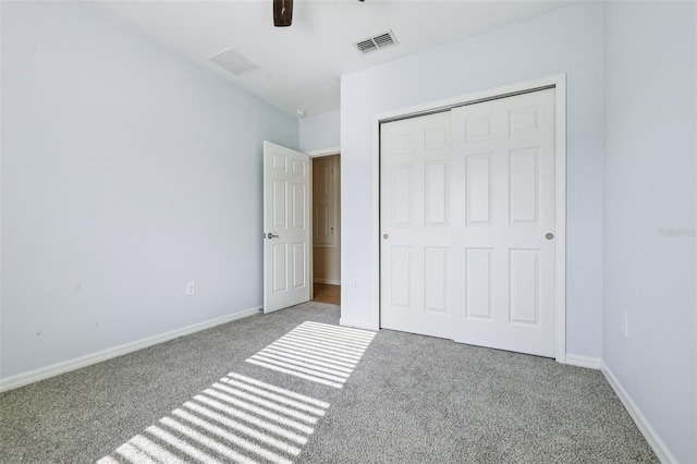 185 Hamlet Loop, Davenport, FL 33837 - unfurnished bedroom featuring carpet, a closet, and a ceiling fan