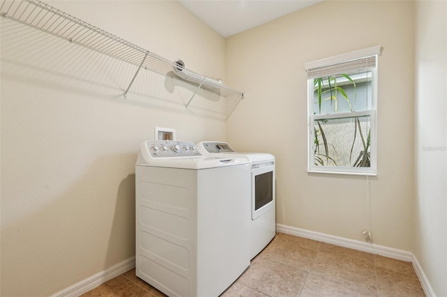 185 Hamlet Loop, Davenport, FL 33837 - laundry area with separate washer and dryer and baseboards
