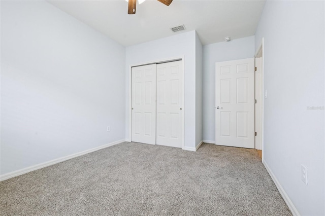 185 Hamlet Loop, Davenport, FL 33837 - unfurnished bedroom featuring carpet floors, a closet, and ceiling fan