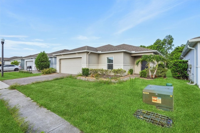 185 Hamlet Loop, Davenport, FL 33837 - view of front of home featuring driveway, an attached garage, stucco siding, a front yard, and a shingled roof