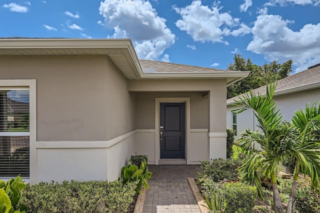 185 Hamlet Loop, Davenport, FL 33837 - entrance to property featuring stucco siding