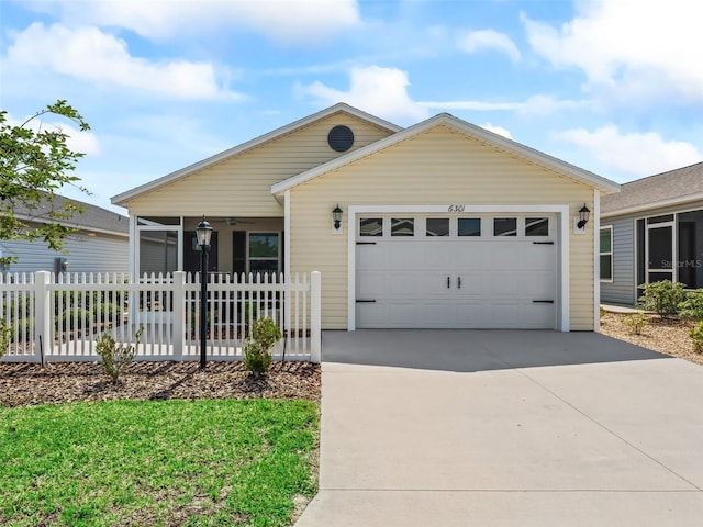 6301 Whittle Ct, The Villages, FL 32163 - ranch-style house with driveway, a garage, and a sunroom