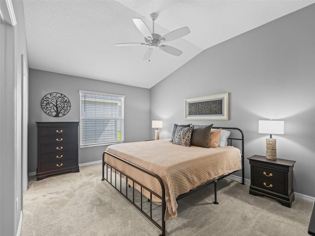 6301 Whittle Ct, The Villages, FL 32163 - bedroom with vaulted ceiling, light carpet, baseboards, and a ceiling fan