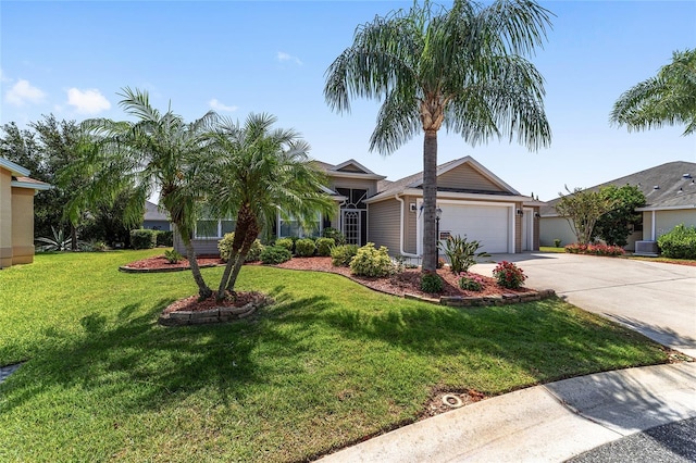 1910 Quiet Oak Ct, The Villages, FL 32162 - view of front of home with driveway, an attached garage, a front yard, and cooling unit