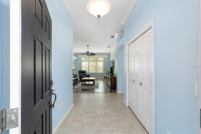 1910 Quiet Oak Ct, The Villages, FL 32162 - foyer featuring light tile patterned floors, crown molding, baseboards, and a ceiling fan