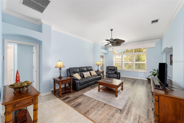 1910 Quiet Oak Ct, The Villages, FL 32162 - living area with ceiling fan, crown molding, baseboards, and light wood finished floors