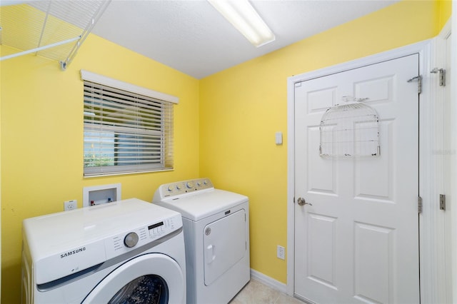 1910 Quiet Oak Ct, The Villages, FL 32162 - laundry area with washer and clothes dryer and baseboards