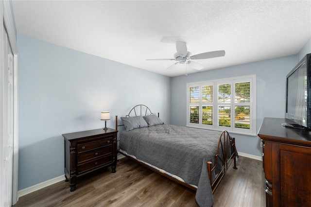 1910 Quiet Oak Ct, The Villages, FL 32162 - bedroom featuring wood finished floors, baseboards, and ceiling fan