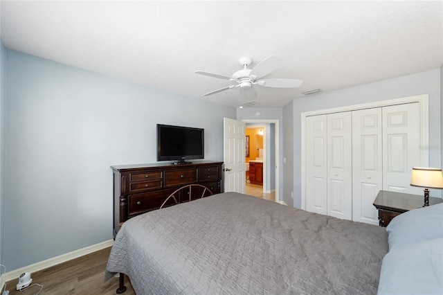 1910 Quiet Oak Ct, The Villages, FL 32162 - bedroom featuring baseboards, wood finished floors, a closet, and ceiling fan