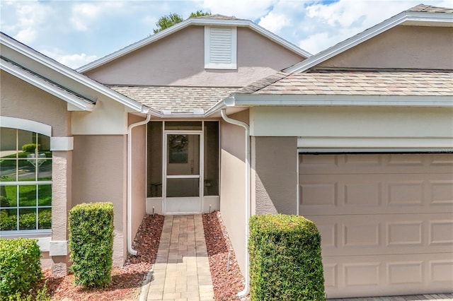 4083 Capland Ave, Clermont, FL 34711 - property entrance featuring stucco siding, an attached garage, and a shingled roof