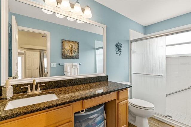 4083 Capland Ave, Clermont, FL 34711 - bathroom with a shower stall, vanity, and toilet